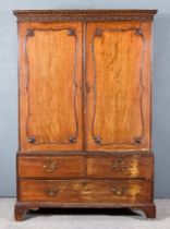 A George III Figured Mahogany Linen Press, the upper part with moulded cornice, blind fret and