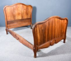 A Late 19th Century Mahogany 4ft 6ins Bedstead, the head and foot board with moulded frames,