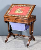 A Victorian Rosewood Work Table, the top inset with needlework panel and with moulded edge, fitted
