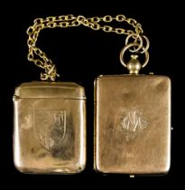 A 9ct Gold Lady's Compact, engraved "IOM", and a 9ct gold Vesta case, both suspended from 9ct gold