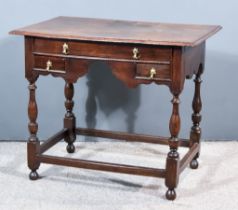 A Late 17th Century Oak Lowboy with two plank and moulded edges to top, fitted three frieze drawers,
