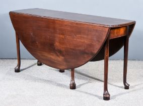A George III Mahogany Circular Drop Leaf Cottage Dining Table, on turned legs with pad feet, 16ins