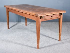 A 19th Century French Provincial Cherry Wood Kitchen Table, with five plank cleated top, draw leaves