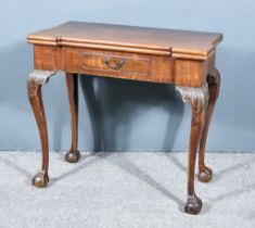 A George II Mahogany Rectangular Tea Table, with re-entrant fronts and sides, the figured folding