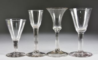 An 18th Century Wine Glass with bell bowl, on plain stem over folded foot, 6.125ins, a cordial glass