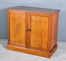 An Early Victorian Mahogany Cabinet, with moulded edge to top, fitted one shelf enclosed by a pair