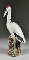 A Chinese Porcelain Figure of a Crested Crane, 20th Century, 13.75ins (34.9cm) high