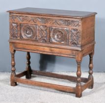 An Old Oak Bible Box, with moulded edge to top, the front carved with leaf and floral roundels, on