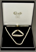 A Cultured Pearl Suite of Jewellery, retailed by Cornells of Maidstone, comprising - a double strand