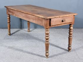 A 19th Century French Provincial Fruit Wood Kitchen Table, with three plank cleated top, fitted