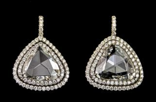 A Pair of Diamond Earrings, by Lugano, each set with a large triangular rose cut diamond,