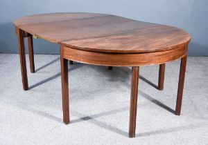 A George III Mahogany Extending Dining Table, comprising two D-end sections, with square edge to