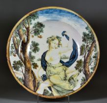 An Italian Castelli Maiolica Charger, Mid 18th Century, painted in colours with a young woman