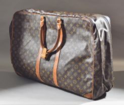 A Louis Vuitton Cirius Travel Suitcase, 20th Century, with leather trim and double rolled leather