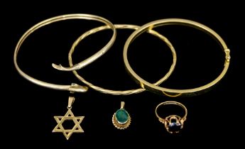 A Quantity of 9ct Gold, comprising - three stiff bangles, a star pendant, a small pendant set with