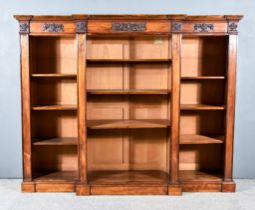 An Early Victorian Rosewood Breakfront Bookcase, with cross banded edge to top, the frieze with