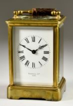 A Late 19th Century French Carriage Clock retailed by Russells Ltd, Paris, the white enamel dial