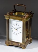 A 20th Century Brass Cased Carriage Clock, by Matthew Norman of London, the white enamel dial with