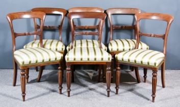 A Set of Six William IV Mahogany Dining Chairs, with plain curved crest rails, leaf carved splats,