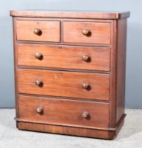 A Victorian Mahogany Chest, with square edge to top, fitted two short and three long graduated