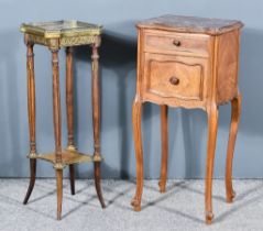 An Early 20th Century French Walnut Bedside Cabinet, of serpentine outline, with flecked marble slab