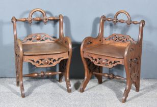 A Pair of 19th Century Oak Hall Chairs, in the manner of Richard Brigdens, with turned crest rail,