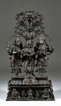 An Indian Bronze Figural Group,19th/20th Century, of three standing deities, the the two outer