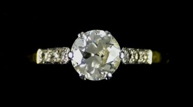 An 18ct Gold and Platinum Diamond Ring,  set with a centre brilliant cut white diamond,