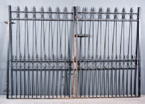 A Pair of 20th Century Wrought Iron Gates, each with fleur-de-lis finials, 50ins wide x 70ins high