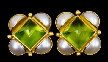 A Pair of 22ct Gold Earrings, for pierced ears, set with faceted peridot stones to the centre