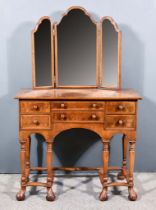 A Walnut Kneehole Dressing Table of "William and Mary" Design, the whole inlaid with herringbone