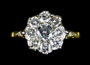 A Diamond Flower Head Ring, set with nine old European cut diamonds, approximately 1ct total, size