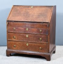 A George III Oak Bureau, the slope with brown leather and gilt tooled inset to fitted interior