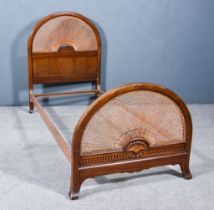 A 20th Century Mahogany Bedstead, the arched head and foot board with cane work, on square