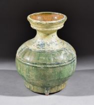 A Chinese Green Glazed Pottery Jar, Han Dynasty, the globular body with incised decoration, 5.
