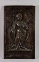 A Carved Oak Panel, Late 16th Century, possibly French, of a standing female figure holding a