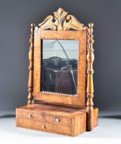 A 19th Century Continental Birch Toilet Mirror, the frame with two turned supports, standing on a