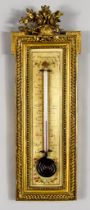 A French Carved Giltwood Thermometer, Late 19th Century, the glass bulb and capillary tube filled