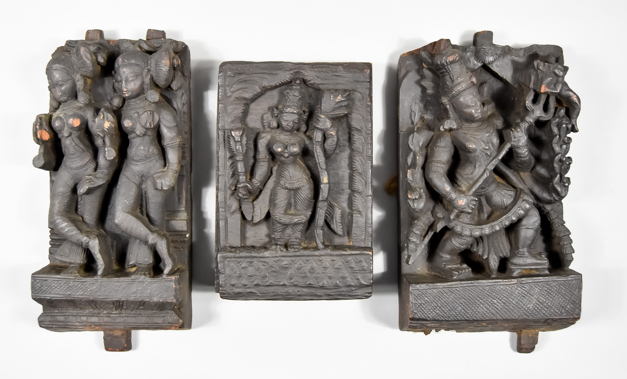 A Carved Teak Hindu Aratha Chariot Panel, 19th Century, depicting Durga with the trident of Shiva,