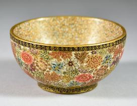 A Japanese Satsuma Bowl, Meiji Period, the exterior decorated with flowers and with black and gilt