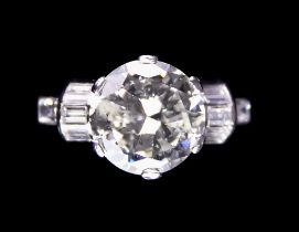 A Platinum Diamond Ring, 20th Century, set with a centre natural brilliant cut white diamond,