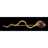 A Serpent Brooch, set with a faceted amethyst stone to the head, 60mm in length, gross weight 4.3g