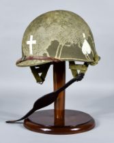 An American Military Helmet, stenciled and carrying markings for Chaplin, with liner, liner