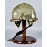 An American Military Helmet, stenciled and carrying markings for Chaplin, with liner, liner