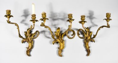 Three 19th Century Gilt Two-Branch Candelabra with Leaf Scroll Moulded Backplates, each with