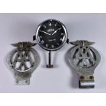 A Jaeger Car Clock, the case stamped X27921 and 721323, the 3ins dial with Roman numerals, and two