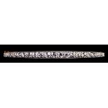 A Bar Brooch, set with brilliant cut white diamonds, approximately 1.25ct total, 54mm overall, gross