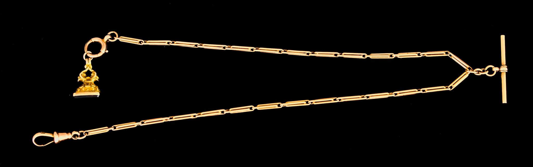 A 9ct Gold Evening Albert Chain, with T-bar and suspended fob, 340mm overall, total gross weight