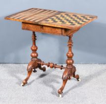 A Victorian Figured Walnut Games Table, the folding top inlaid with rosewood and satinwood chess and