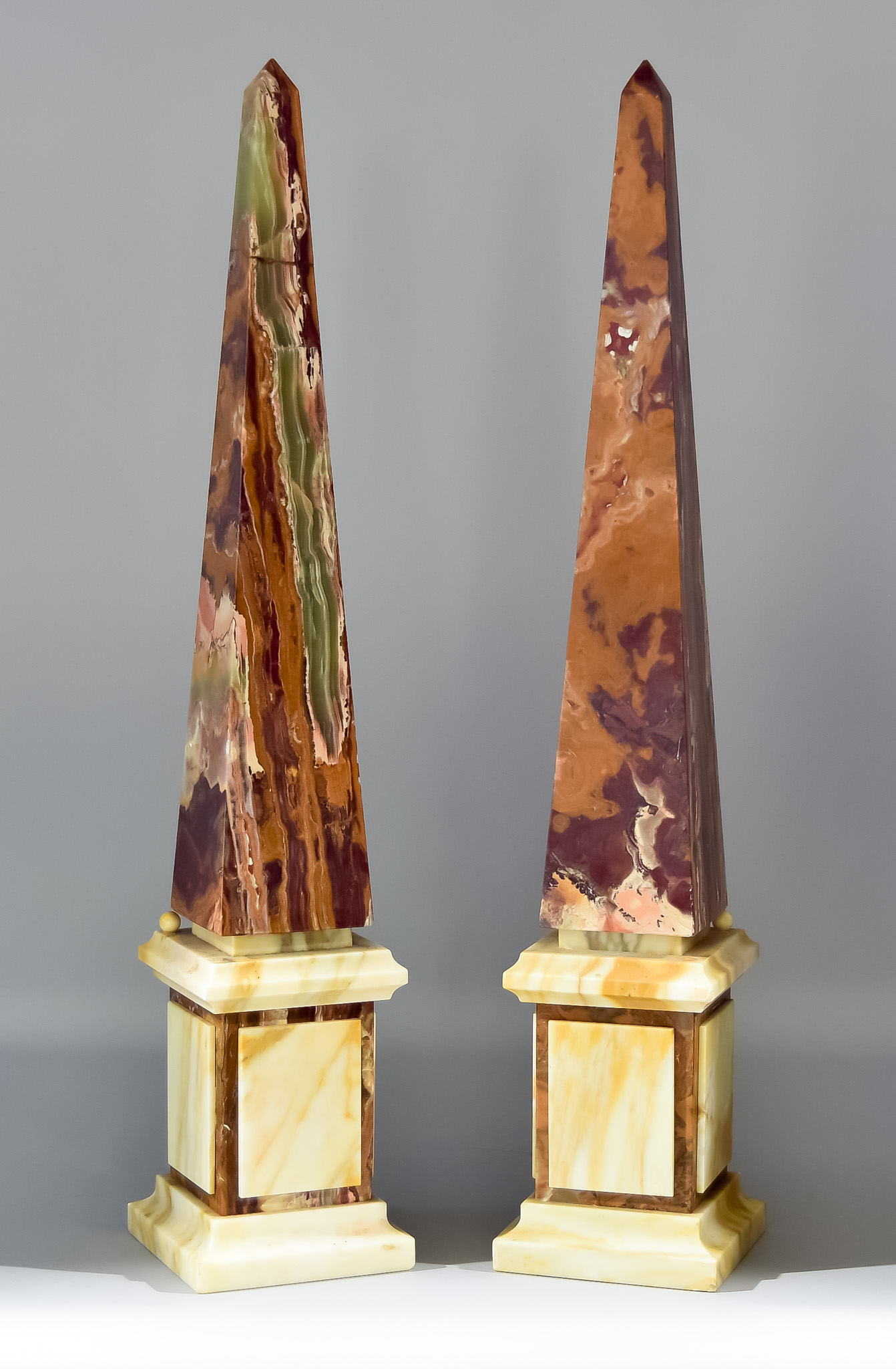 A Pair of Grand Tour Variagated Marble Obelisks, 19th/20th Century, on square plinth bases, 28ins